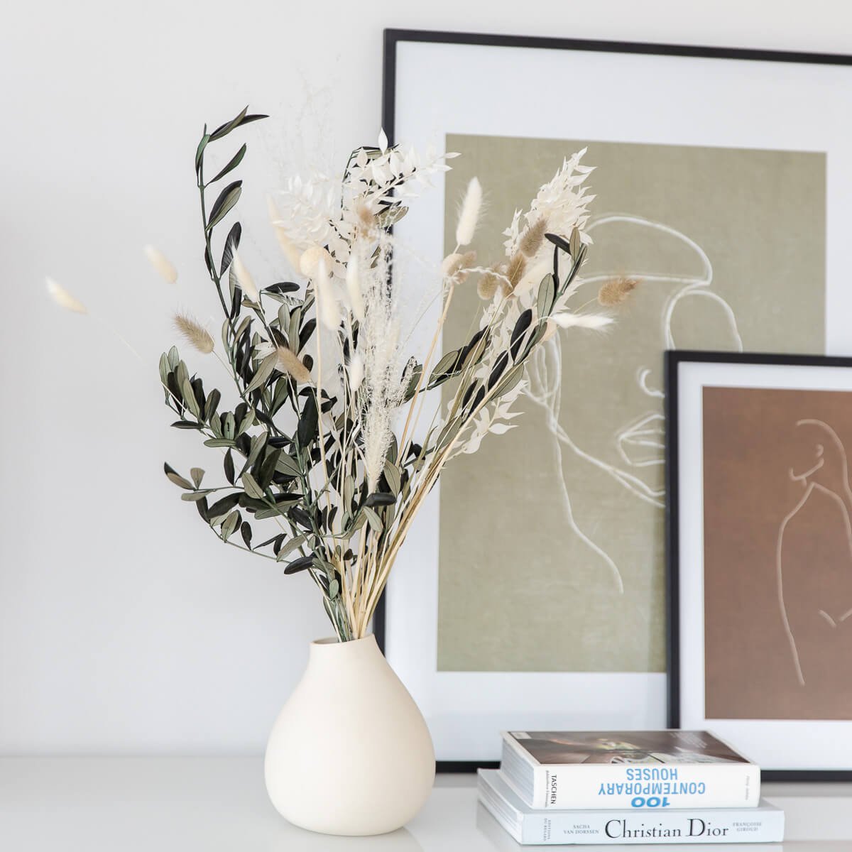 Perfect decoration: dried flower bouquet with olive branches in beige